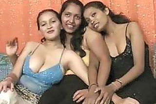 Smashing Indian babes have steamy lesbian threesome on the sofa